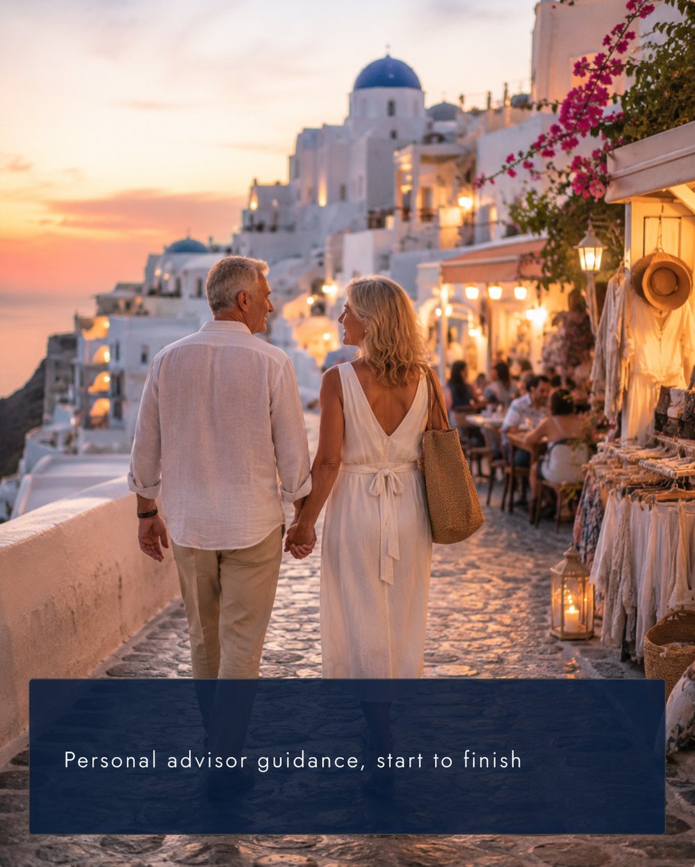 A couple walking a Santorini street at sunset — personal advisor guidance, start to finish